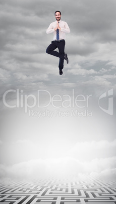 Composite image of smiling businessman standing in tree pose