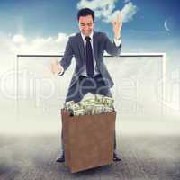 Composite image of screaming businessman catching