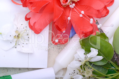 Office table with flower, ribbons, pencil, candles