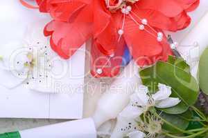 Office table with flower, ribbons, pencil, candles