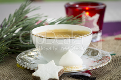 Cup of festive Christmas coffee with cookies