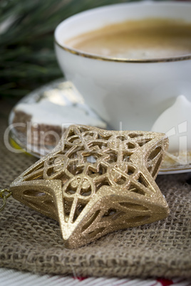 Cup of festive Christmas coffee with cookies