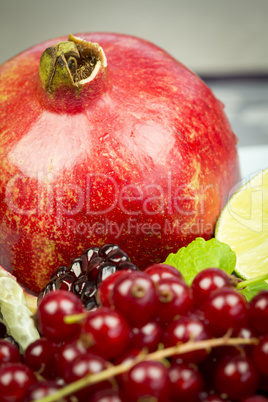 Assorted fresh fruit and berries on a plate