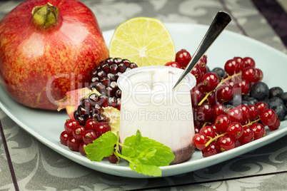 Vanilla yogurt with fresh fruit and berries