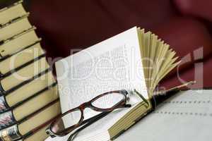 Reading glasses on an open book