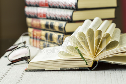 Open book with decorative folded pages