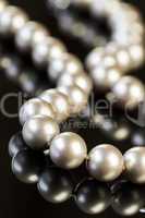 Elegant Pearl Necklace on Glossy Table