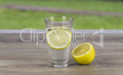 Glass of fresh cold mineral water with lemon