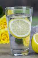 Glass of fresh cold mineral water with lemon