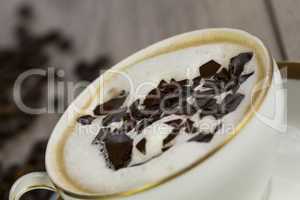 Cup of fresh cappuccino with chocolate flakes