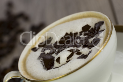 Cup of fresh cappuccino with chocolate flakes
