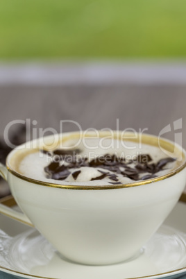 Cup of fresh cappuccino with chocolate flakes