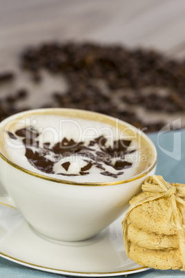 Delicious aromatic cappuccino with cookies