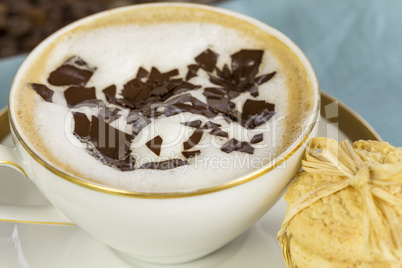 Delicious aromatic cappuccino with cookies