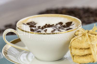 Delicious aromatic cappuccino with cookies