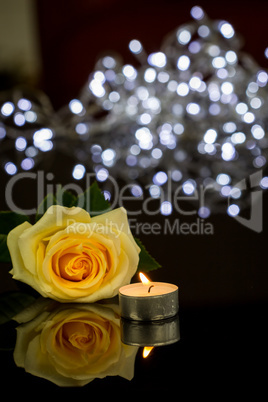 Rose, Candle and Jewelry Present Gift Box on Table