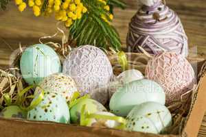 Hand decorated Easter Eggs in straw