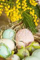 Hand decorated Easter Eggs in straw