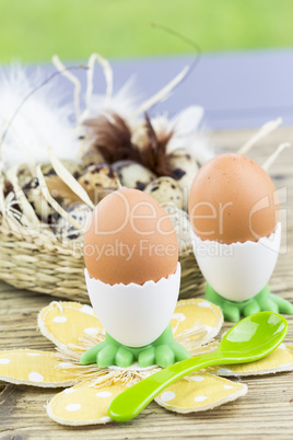 Two Boiled Eggs in Egg Cups Next to Basket of Eggs