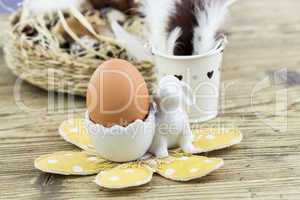 Two Boiled Eggs in Egg Cups Next to Basket of Eggs