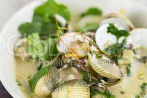 Bowl of delicious seafood ragout with coriander
