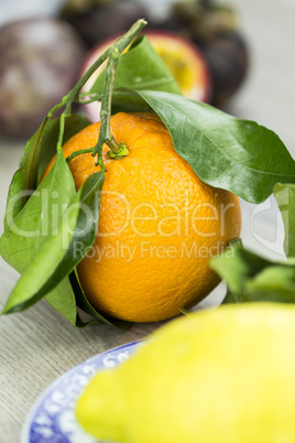 Fresh yellow lime or lemon on a plate