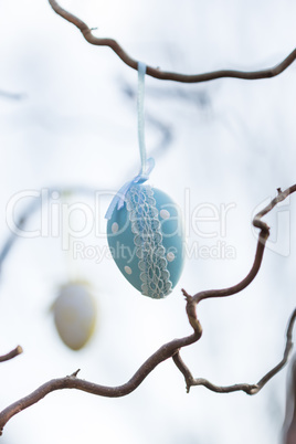 Pretty polka dot Easter eggs hanging in a tree