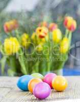 Group of colorful Easter eggs on a rustic table