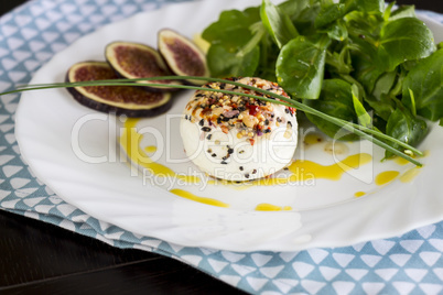 Delicious appetizer of goats milk cheese and figs