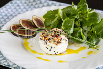 Delicious appetizer of goats milk cheese and figs