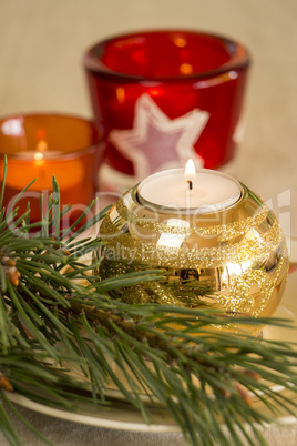 Christmas background with a golden candle