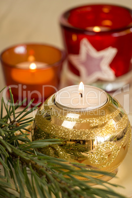 Christmas background with a golden candle