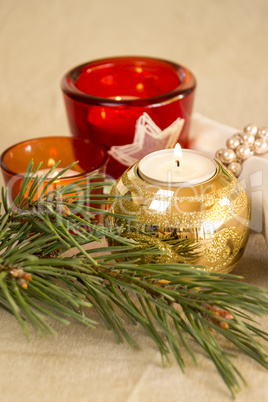 Christmas background with a golden candle