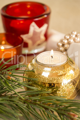 Christmas background with a golden candle