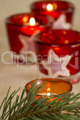 Christmas background with a golden candle