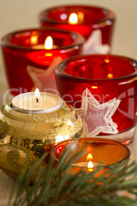 Christmas background with a golden candle