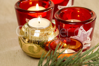 Christmas background with a golden candle