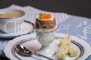 Boiled egg with caviar for breakfast