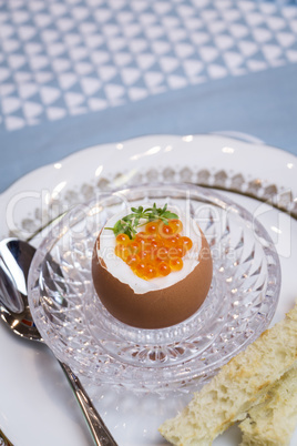 Boiled egg with caviar for breakfast