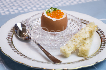 Boiled egg with caviar for breakfast