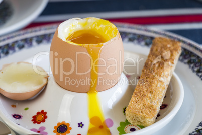 Breakfast of boiled egg, coffee and pastries