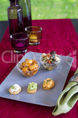 Selection of Appetizers on Square Plate on Table