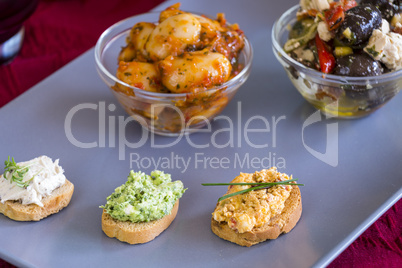 Selection of Appetizers on Square Plate on Table