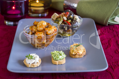 Selection of Appetizers on Square Plate on Table
