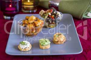 Selection of Appetizers on Square Plate on Table