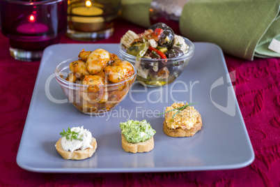 Selection of Appetizers on Square Plate on Table