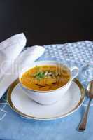 Garnished pumpkin Soup in Tea Cup