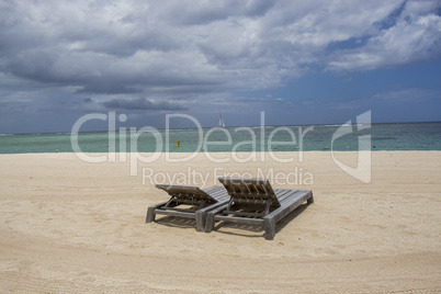 Storm clouds gathering over a tranquil beach