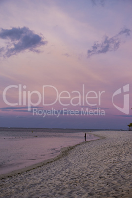 Colorful tropical sunset over a calm ocean