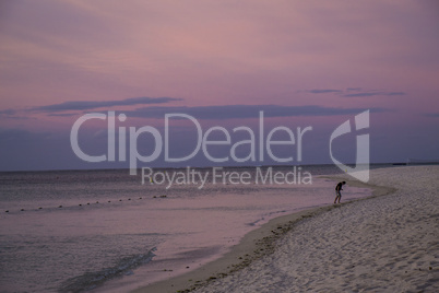 Colorful tropical sunset over a calm ocean